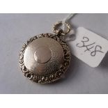 A circular 19thc fancy gold locket 5.8g