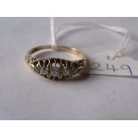 Antique diamond ring set with 5 diamonds in an 18ct gold setting with carved shoulders size Q