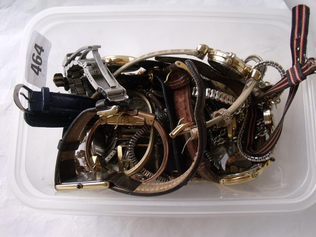 A tub containing various wrist watches
