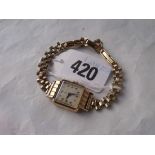 Ladies 9ct wrist watch on metal strap