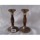 A pair of wooden mounted candle sticks 6” high Birm.1926