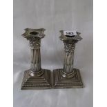 Pair of Victorian candlesticks with Corinthian capitals. Detachable nozzles 5in high. London 1900.