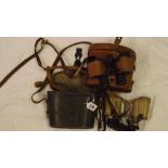 A cased pair of sand coloured binoculars 6 x 30