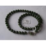 String of Jadeite beads with silver clasp