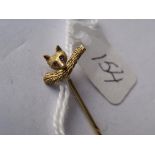 Gold top cravat pin of a fox with a brush(tail) set with pink stone eyes