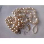 Three pearl necklaces 2 with 9ct clasps