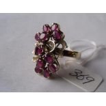A pink stone modernist gold mounted ring