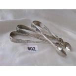 Three pairs of Georgian sugar tongs, two with bright cut decoration 1804,1830 etc. 95g
