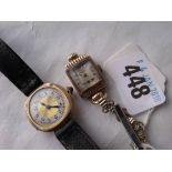 Gold ladies rounded wrist watch and metal example