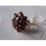 Large garnet flowerhead 9ct dress ring approx size 'N'