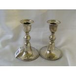 A pair of circular candle sticks 5” high unmarked