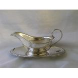 An American heavy sauce boat on stand 7.5” over handle marked sterling 360g