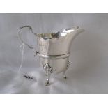 George I style jug on three hoofed feet. 4in high. London 1930. By WW. 180g.