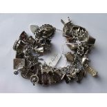 A good vintage silver charm bracelet with many quality charms 125.6g