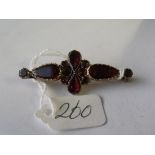 An antique gold mounted garnet set brooch 4.5cm long