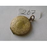 A circular 9ct engraved back & front locket