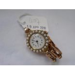 Ladies 18ct gold pearl set wrist watch on 15ct gold strap 23.5g inc