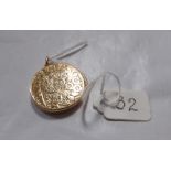 Antique 15ct gold chased circular locket.