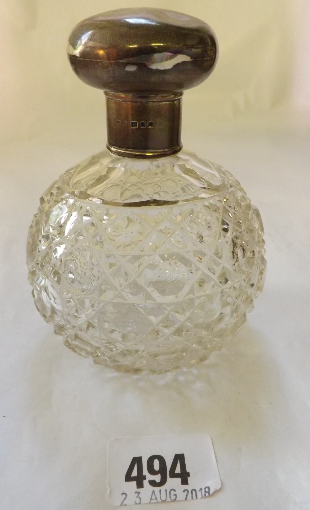 Circular scent bottle with cut glass body London 1930?