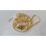 Three strand cultured pearl necklace with fancy 9ct clasp