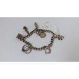 Small silver charm bracelet with charms 26g