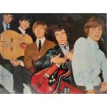 Rolling Stones, photograph published in Fab Magazine signed. A colour photograph of the band, signed