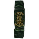 Circa 1798. United Irishmen ribbon badge. Gold stamped on green cloth: "Erin go brach" handshake