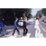 The Beatles, Abbey Road, photograph A candid photograph of the Beatles walking across the famous