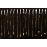 15 gold crosses, medals and chains. Various 9 carat gold crosses, crucifixes and religious medals on