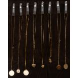 Sixteen various 9ct gold pendants on chains. Including a plain gold disc, a St. Christopher medal,