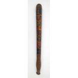 A decorated police trunceon. An early 20th century truncheon, the shaft ebonised and decorated