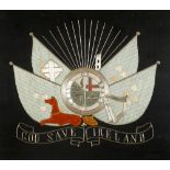 19th century silk needlework panel Erin go Bragh Centred with the arms of the Provinces flanked by