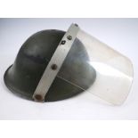 1970 Raglan Street, Falls Curfew, British Army steel helmet with visor. A British Mk IV steel