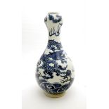 A Chinese blue and white porcelain garlic-mouth bottle vase. Decorated in underglaze blue with a