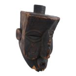 Tribal mask, Bushongo, Central Congo. A large carved helmet-shaped secret society mask, 15.50 by 7.