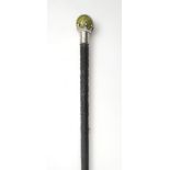 Late 19th century silver- and Connemara marble-mounted bog oak cane. A Victorian bog oak tapering