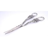 A pair of George III Irish silver grape scissors. The rings mounted to bunches of grapes and