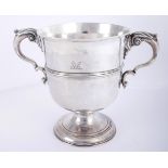 A George III Cork silver two-handled cup, by John Williams. The leaf-capped, double 'c'-scroll