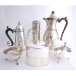 A collection of George V silver wares by Asprey, Mappin and Webb and Adie. A hot water jug,