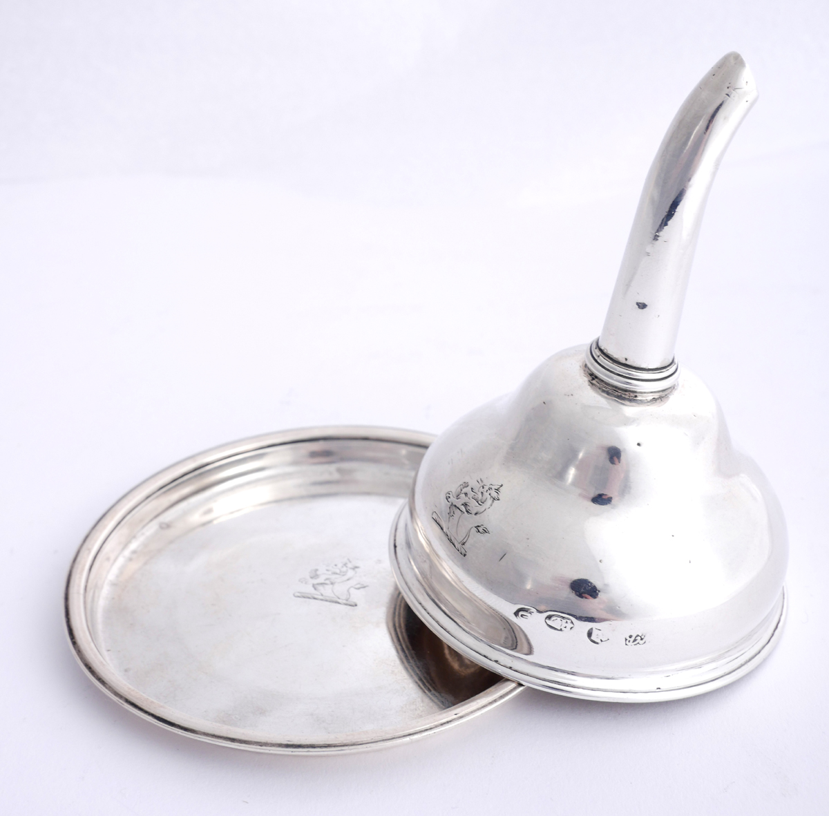 A George III Irish silver wine-funnel and stand, by William Bond. The wine funnel with curved spigot