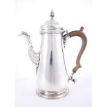 George II silver coffee pot The body of tapering form with tucked base on moulded foot, the domed
