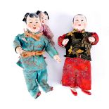 Early 20th century Chinese dolls. Three costume dolls, a woman with a baby on her back and a man,