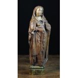 A 16th Century Flemish Carved Oak Sculpture of a Female Saint with traces of polychrome and a