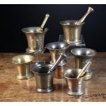 A Collection of Seven 18th Century Bronze Mortars and four pestles.