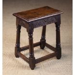 A Good 17th Century Oak Joint Stool with lunette carved rails and astrigal ringed legs united by