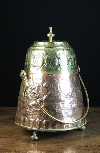 An 18th/19th Century Dutch Copper Ash Pot with brass handle and lid.