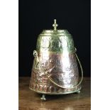 An 18th/19th Century Dutch Copper Ash Pot with brass handle and lid.