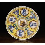 A Maiolica Plate decorated in ochre, blue,