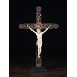 A Late 18th Century Wooden Crucifix infilled with carved gilded rolled paper embellishments and