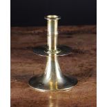 A 17th Century English Brass Trumpet base Candlestick with mid drip pan, 5¼ in (13.25 cm) in height.